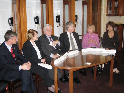 Judy fields questions from reporters about her genetics bill.  Pictured left to right are Rep. Andrews, Rep. Slaughter, Sen. Kennedy; Dr. Francis Collins, Director of the National Human Genome Research Institute, Rep. Biggert, and Rep. Eshoo.